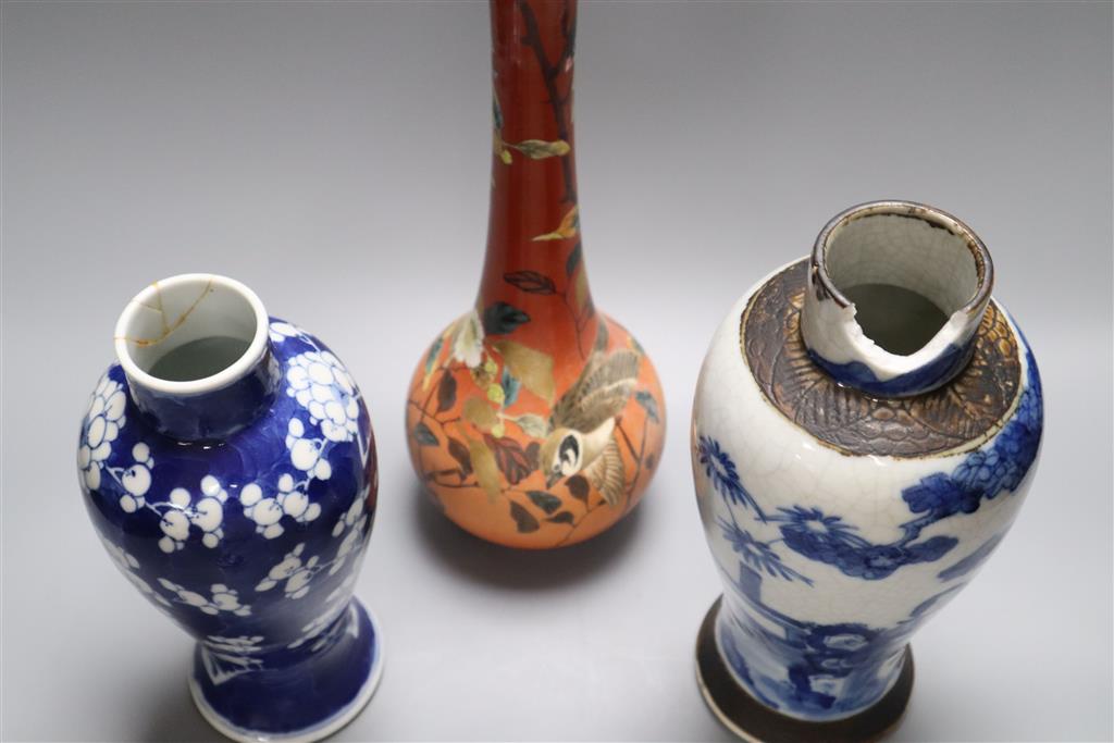 A Satsuma vase, 34cm, and two Chinese blue and white porcelain baluster jars and covers, all late 19th/early 20th century